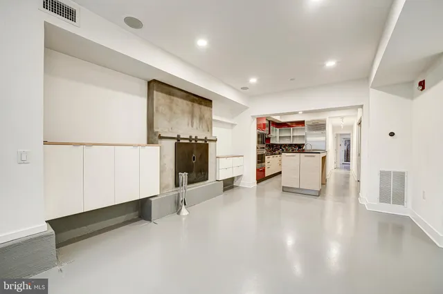 a kitchen with stainless steel appliances a refrigerator and a stove top oven