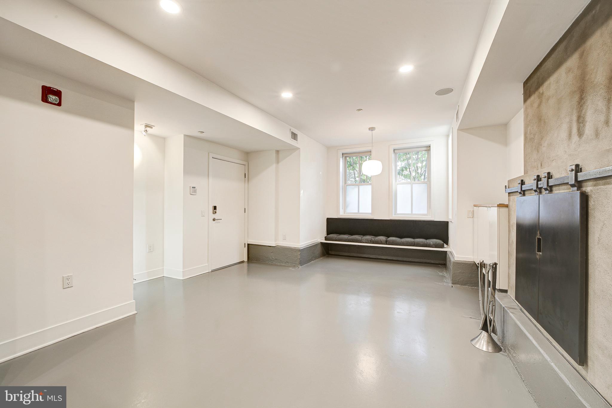 1517 Church Street Northwest, Unit A Washington, DC 20005 - Photo 4 of 23 a view of a room with gym equipment and a window