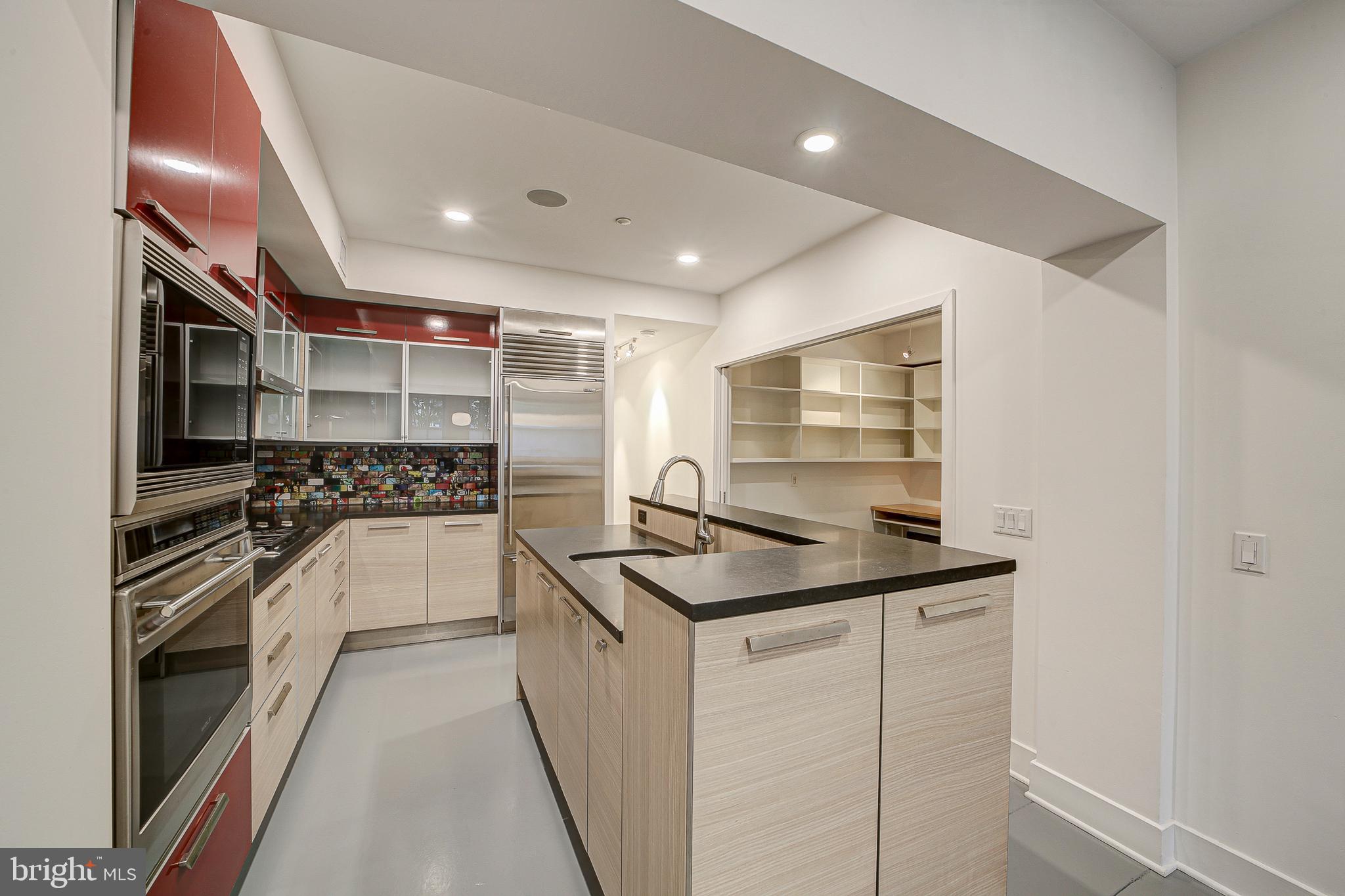 1517 Church Street Northwest, Unit A Washington, DC 20005 - Photo 6 of 23 a kitchen that has a sink and stainless steel appliances