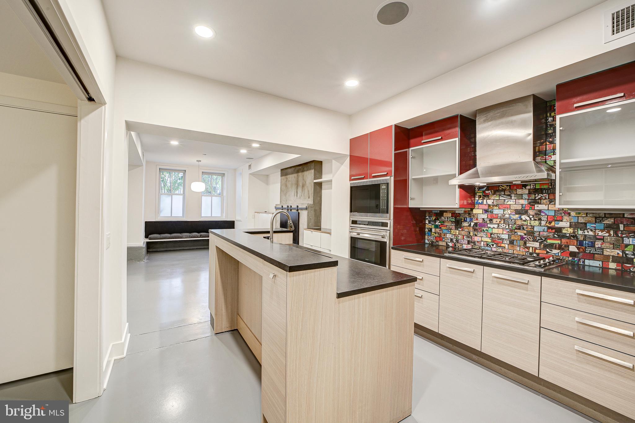 1517 Church Street Northwest, Unit A Washington, DC 20005 - Photo 8 of 23 a kitchen with stainless steel appliances granite countertop a sink and cabinets