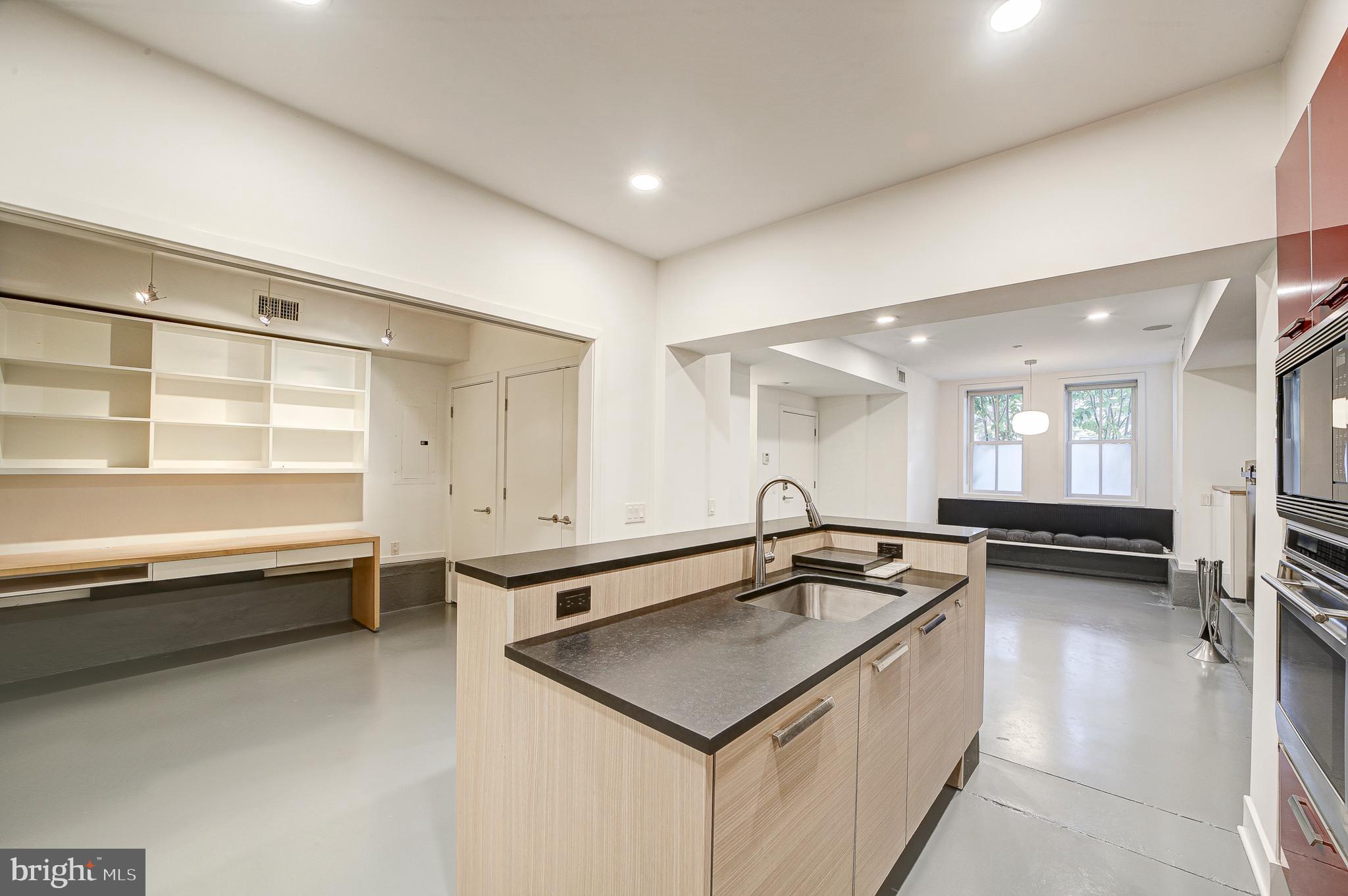 1517 Church Street Northwest, Unit A Washington, DC 20005 - Photo 9 of 23 a kitchen with a sink a stove and a refrigerator