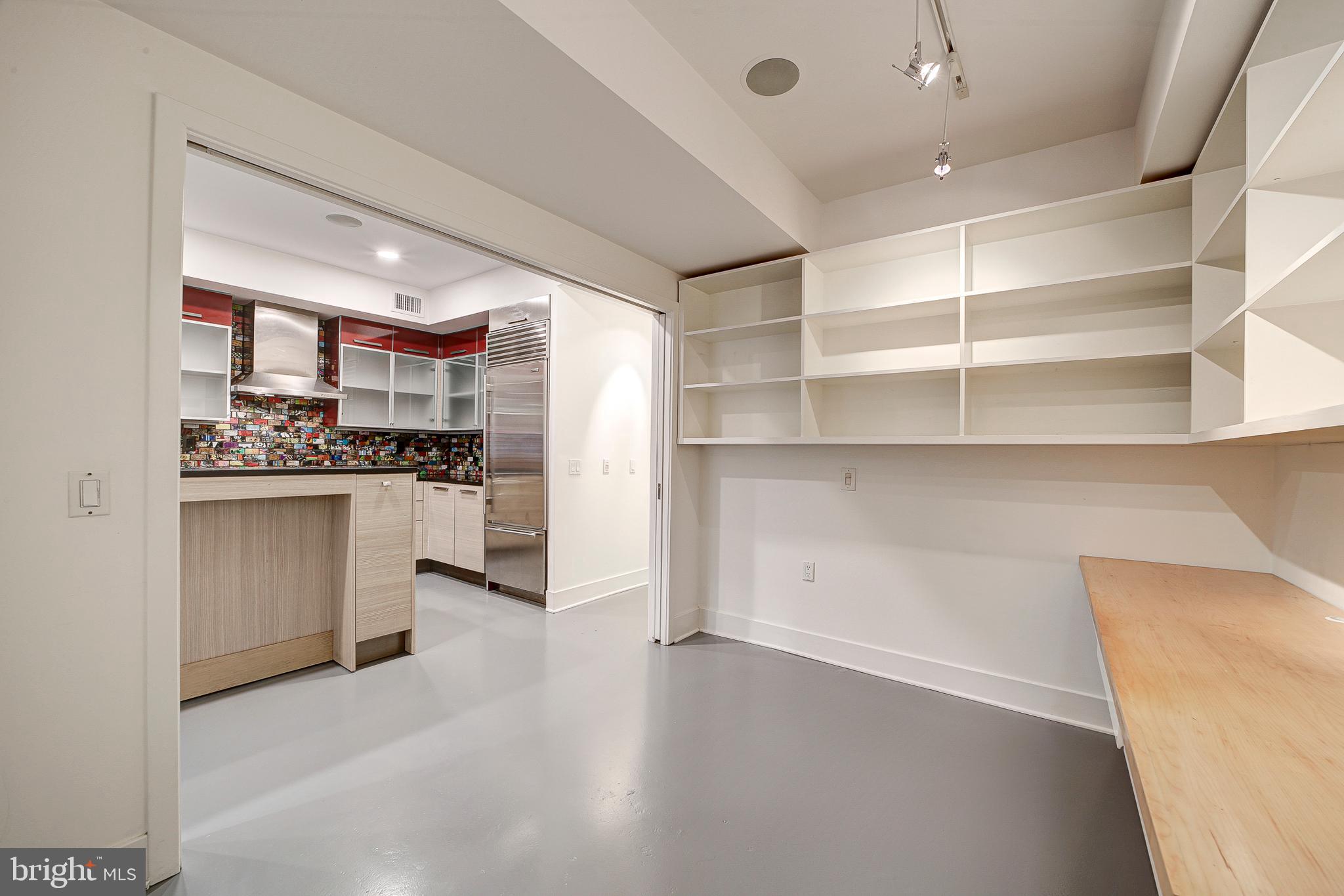 1517 Church Street Northwest, Unit A Washington, DC 20005 - Photo 10 of 23 a kitchen with white cabinets and appliances