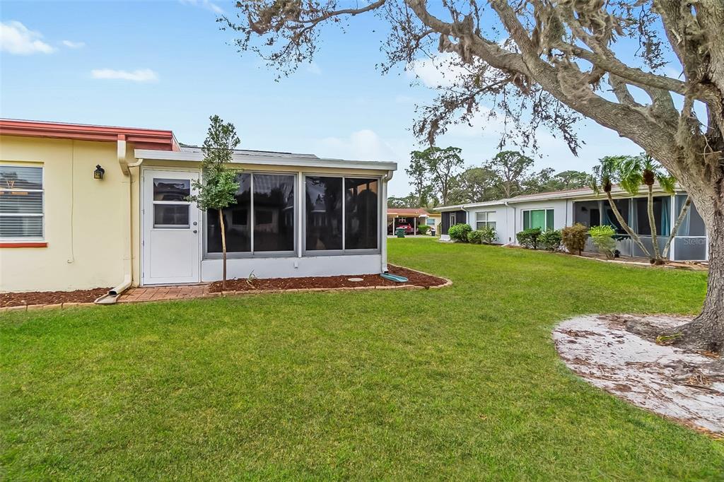 3533 Tree Line Court, Unit 13 Sarasota, FL 34231 - Photo 32 of 38 a view of a house with a garden