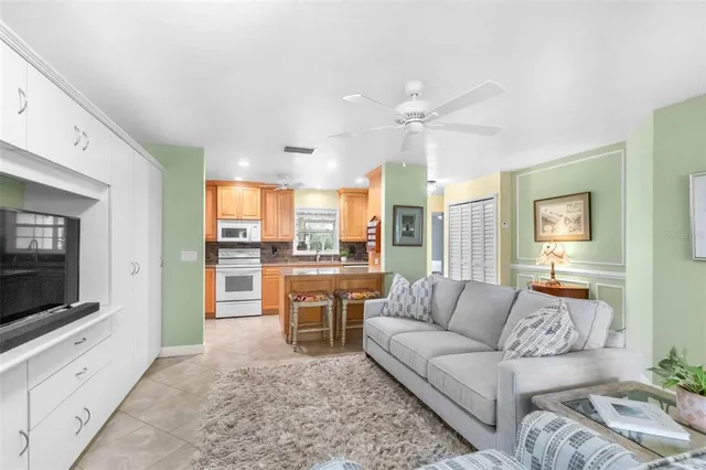 a kitchen with a stove sink and cabinets