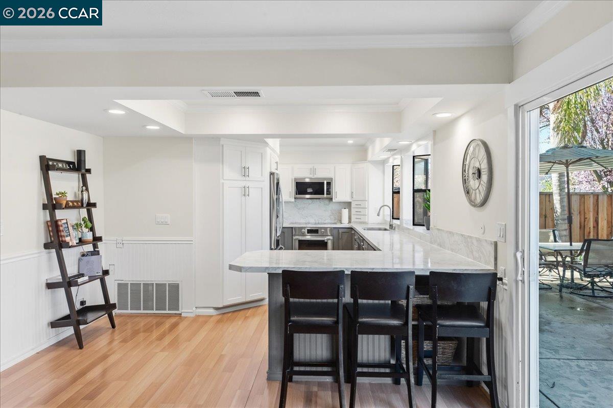 10005 Foxboro Circle San Ramon, CA 94583 - Photo 17 of 48 a view of a dining room with furniture and a chandelier