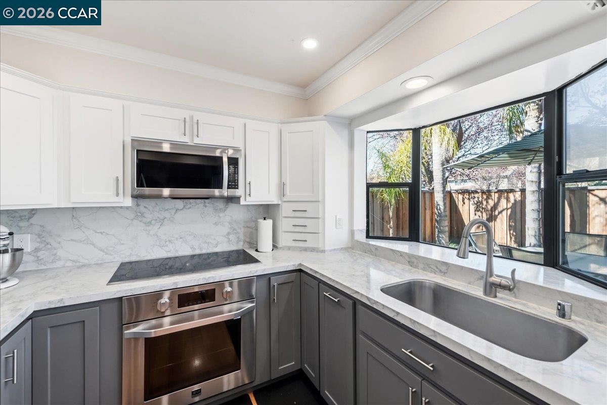 10005 Foxboro Circle San Ramon, CA 94583 - Photo 20 of 48 a kitchen with a sink stove top oven and cabinets