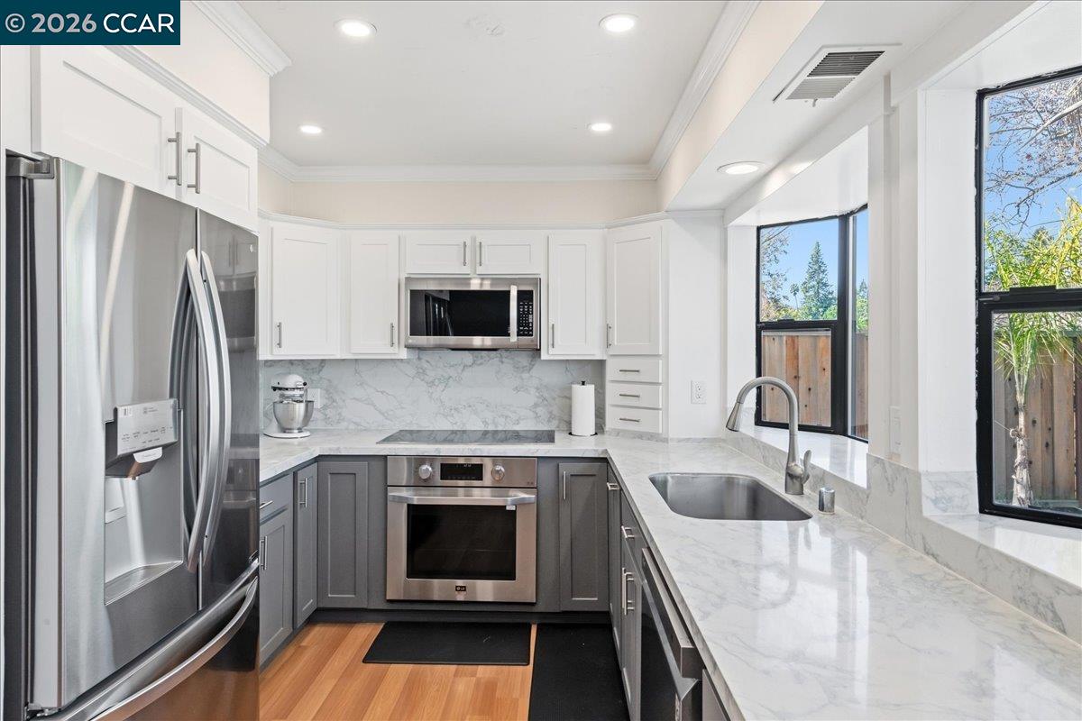 10005 Foxboro Circle San Ramon, CA 94583 - Photo 21 of 48 a kitchen with a sink stove and refrigerator