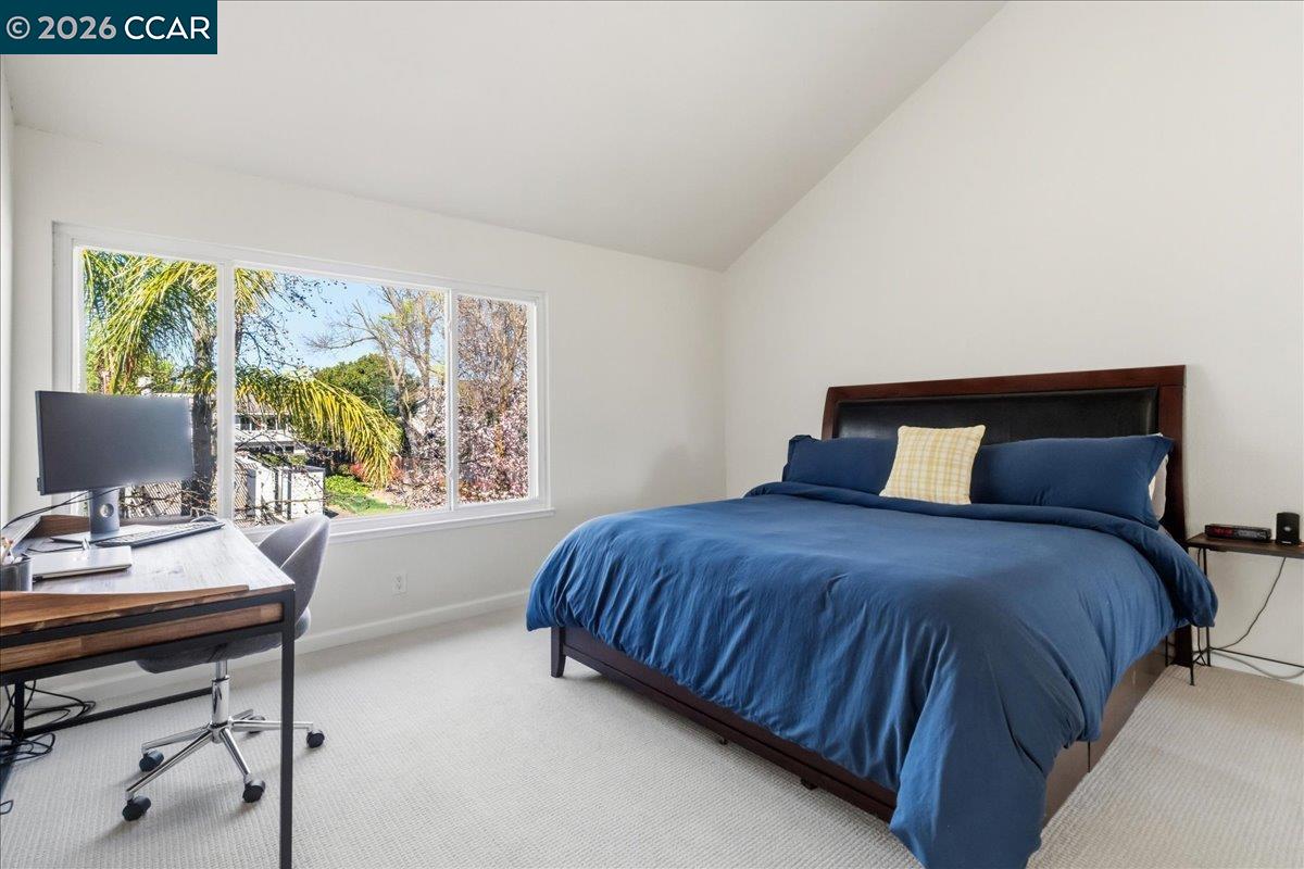 10005 Foxboro Circle San Ramon, CA 94583 - Photo 25 of 48 a bedroom with a bed a computer on a desk and next to a window