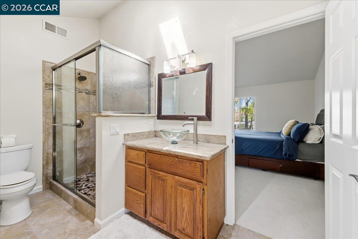 10005 Foxboro Circle San Ramon, CA 94583 - Photo 28 of 48 a spacious bathroom with a double vanity sink toilet and shower