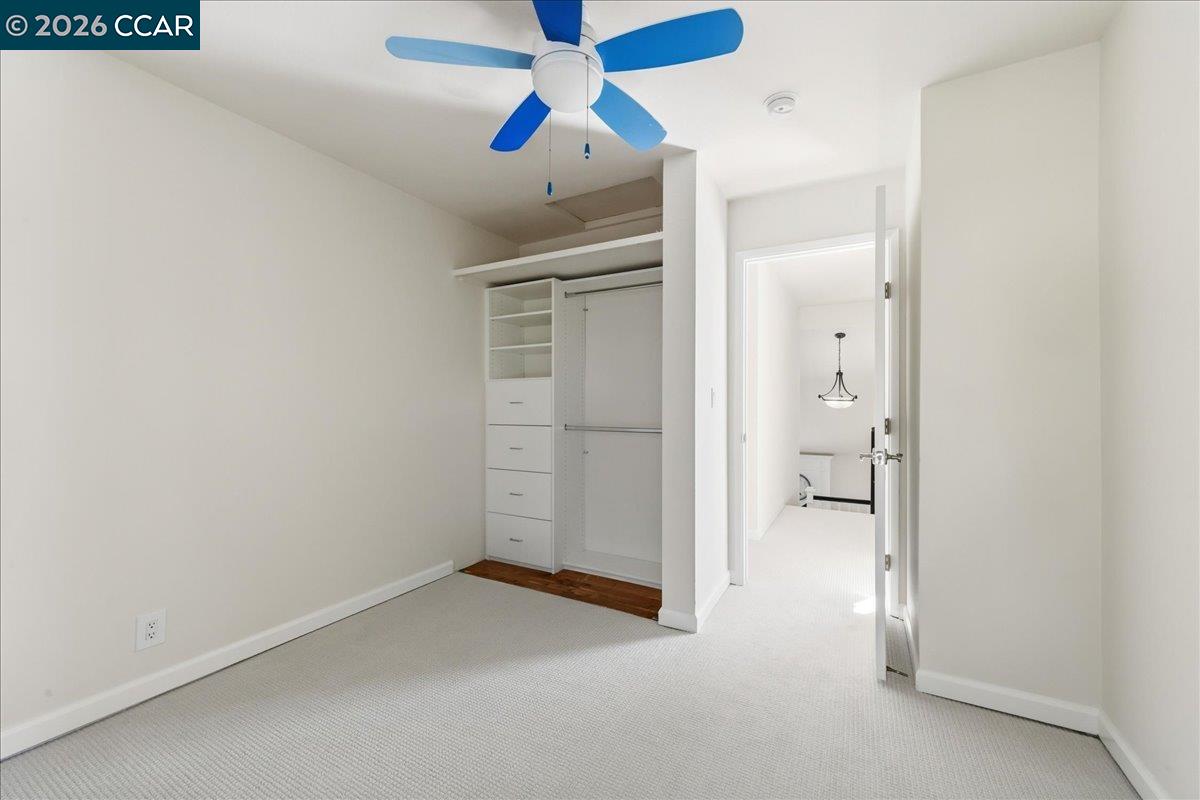 10005 Foxboro Circle San Ramon, CA 94583 - Photo 34 of 48 an empty room with closet and a chandelier fan