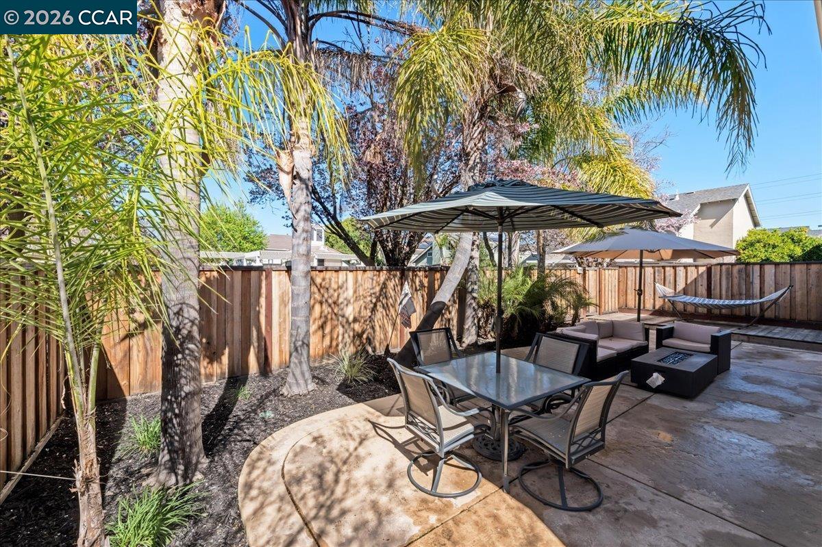 10005 Foxboro Circle San Ramon, CA 94583 - Photo 38 of 48 a view of a backyard with furniture and umbrella