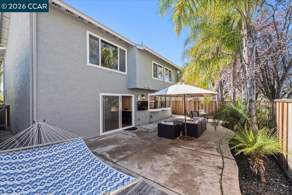 10005 Foxboro Circle San Ramon, CA 94583 - Photo 39 of 48 a view of a patio with table and chairs under an umbrella