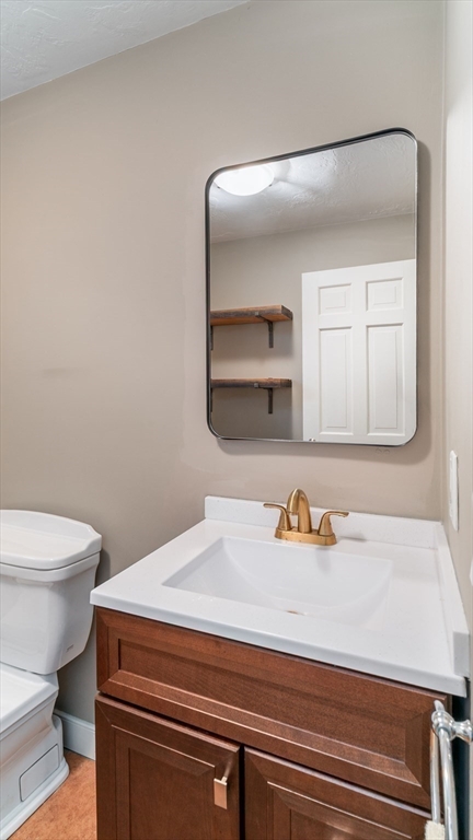 142 Baker Street Walpole, MA 02081 - Photo 13 of 42 a bathroom with a sink and a toilet