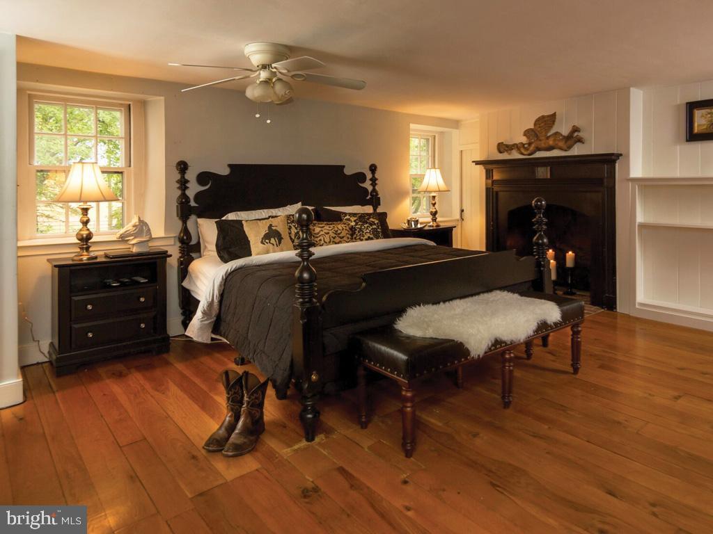 1375 Chestnut Tree Road Honey Brook, PA 19344 - Photo 11 of 15 a bedroom with furniture and a fireplace