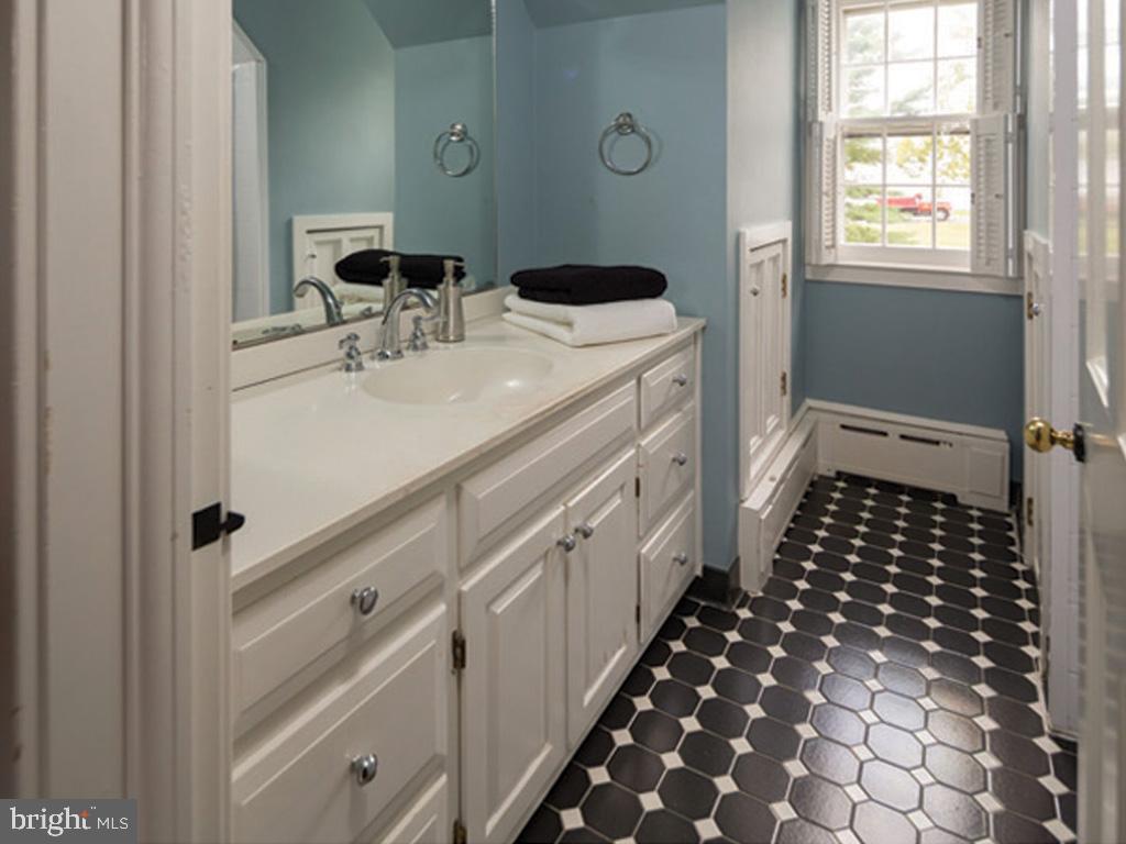 1375 Chestnut Tree Road Honey Brook, PA 19344 - Photo 12 of 15 a bathroom with a sink and a mirror