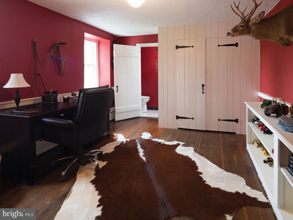 1375 Chestnut Tree Road Honey Brook, PA 19344 - Photo 13 of 15 a bedroom with a bed and a potted plant