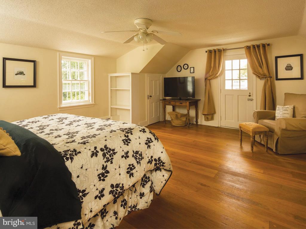 1375 Chestnut Tree Road Honey Brook, PA 19344 - Photo 14 of 15 a spacious bedroom with a bed and a couch