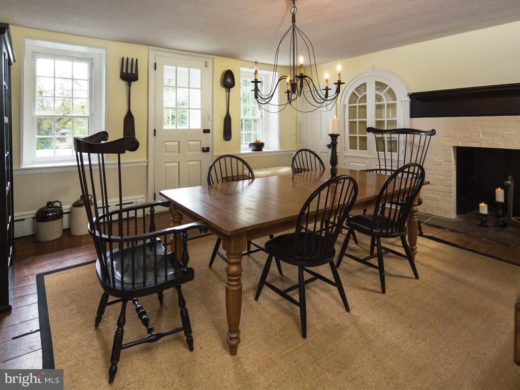 1375 Chestnut Tree Road Honey Brook, PA 19344 - Photo 5 of 15 a view of a dining room with furniture wooden floor and chandelier