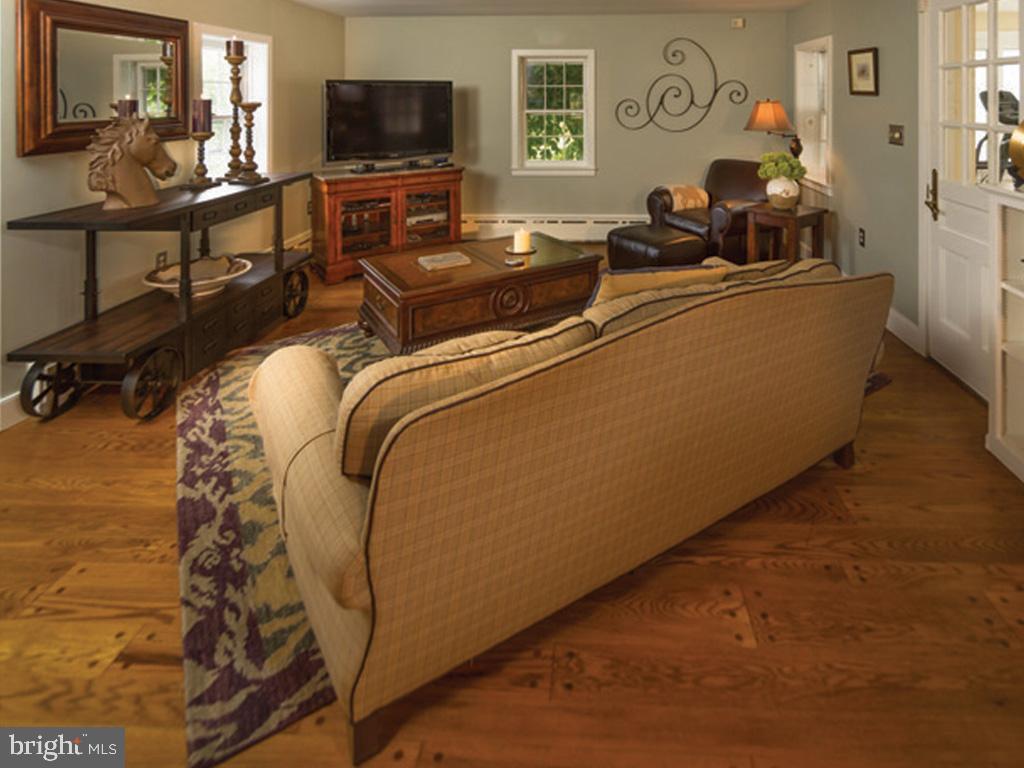 1375 Chestnut Tree Road Honey Brook, PA 19344 - Photo 10 of 15 a living room with furniture and a flat screen tv