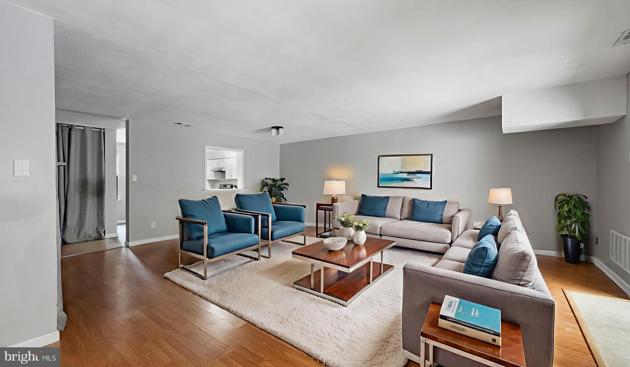 607 Bromley Estate Pine Hill, NJ 08021 - Photo 2 of 14 Virtually Staged Living Room Looking into Kitchen