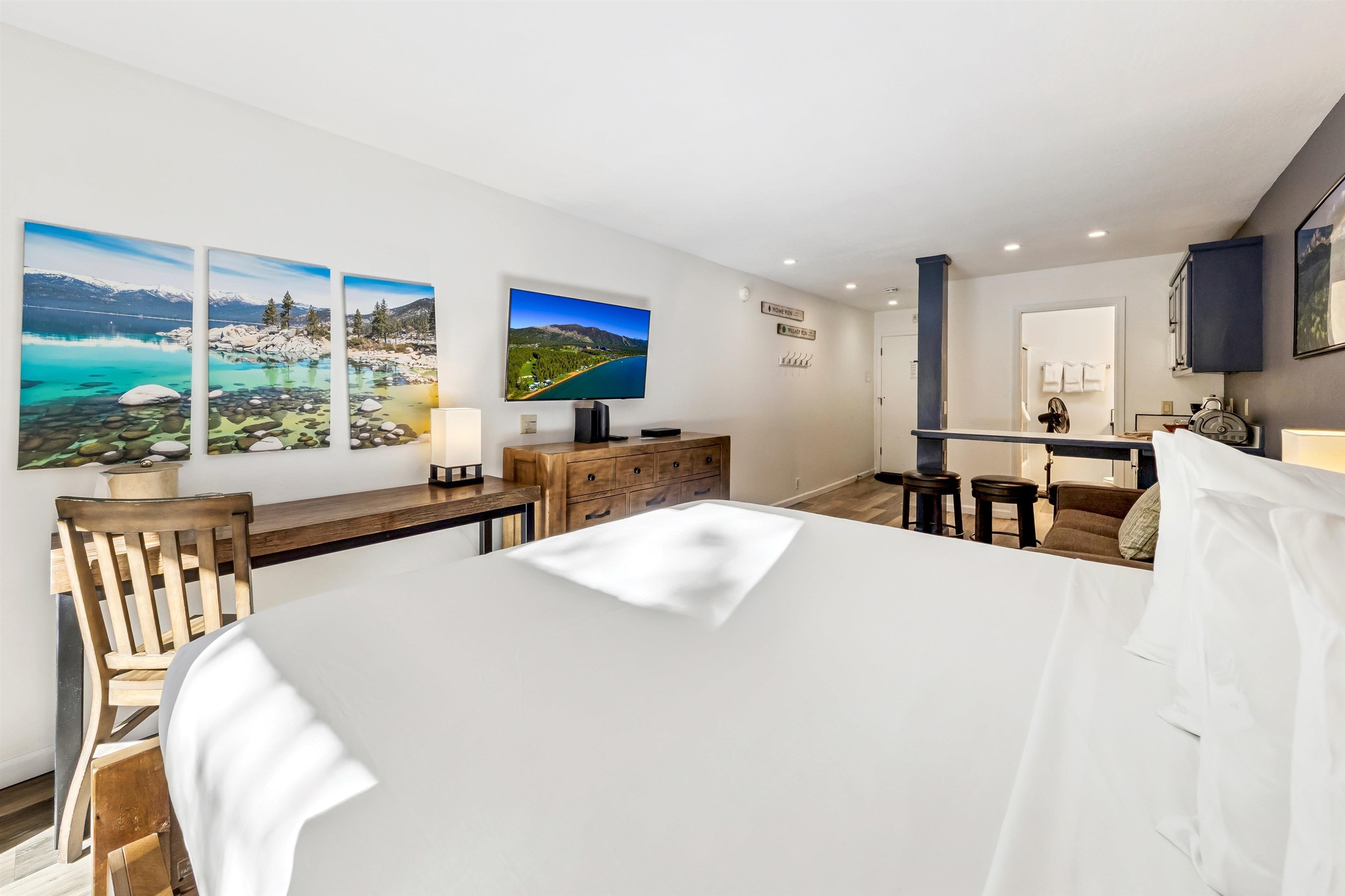 2000 North Village Drive, Unit 234 Truckee, CA 96161 - Photo 11 of 27 a view of a kitchen with kitchen island a large window cabinets a sink and stainless steel appliances
