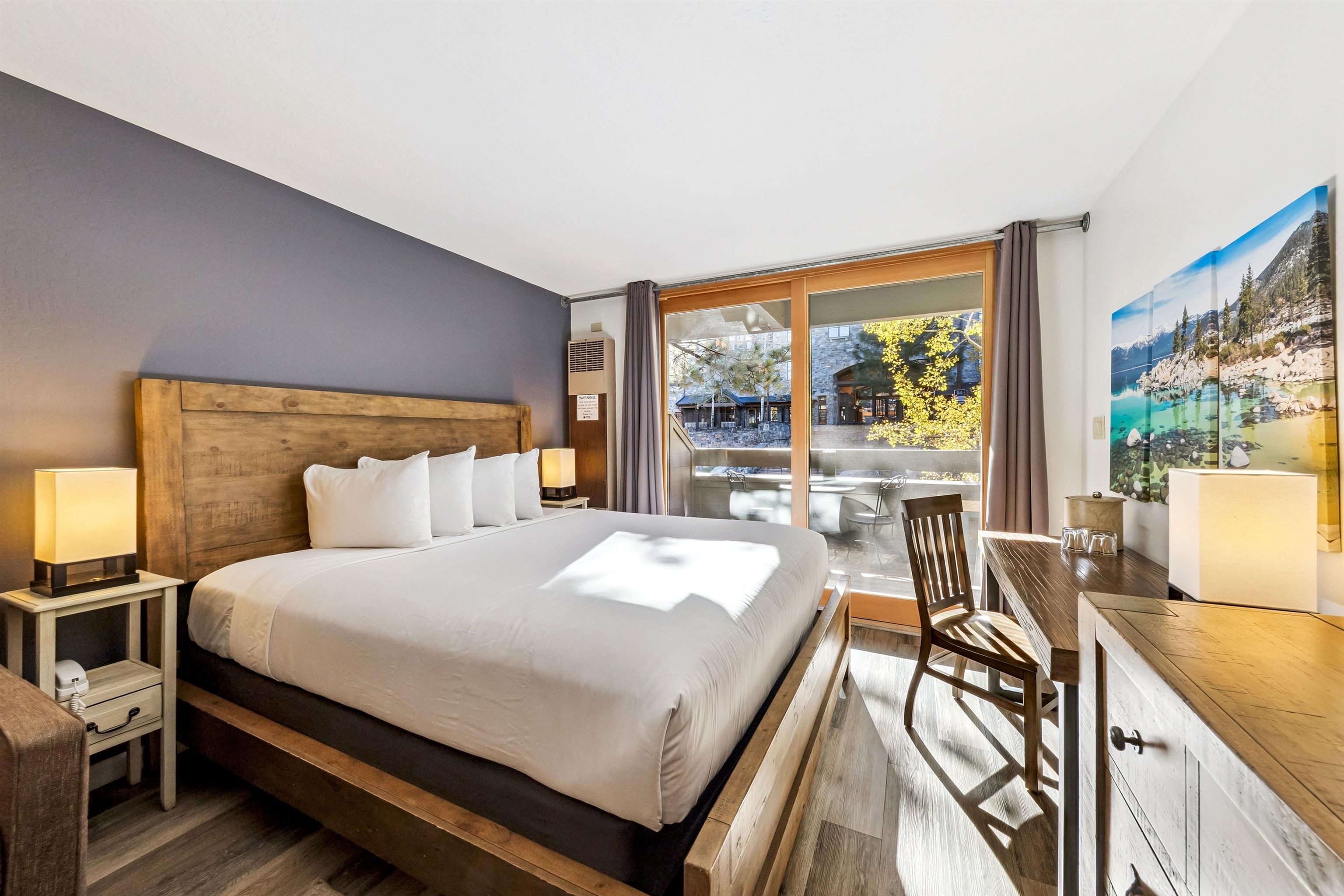 2000 North Village Drive, Unit 234 Truckee, CA 96161 - Photo 3 of 27 a bedroom with a bed and a large window with outer view