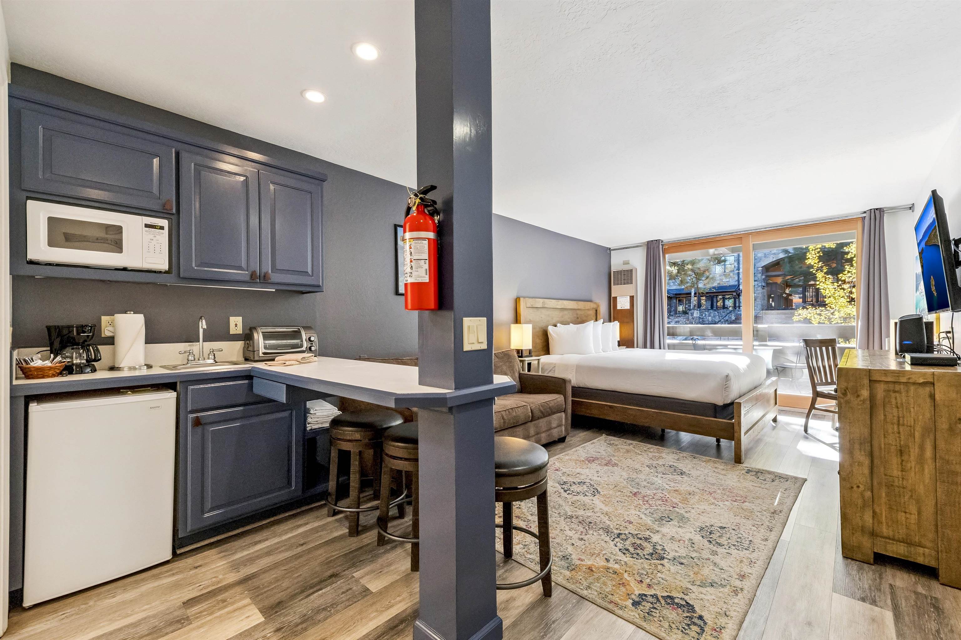 2000 North Village Drive, Unit 234 Truckee, CA 96161 - Photo 4 of 27 a living room with stainless steel appliances granite countertop furniture wooden floor and a rug