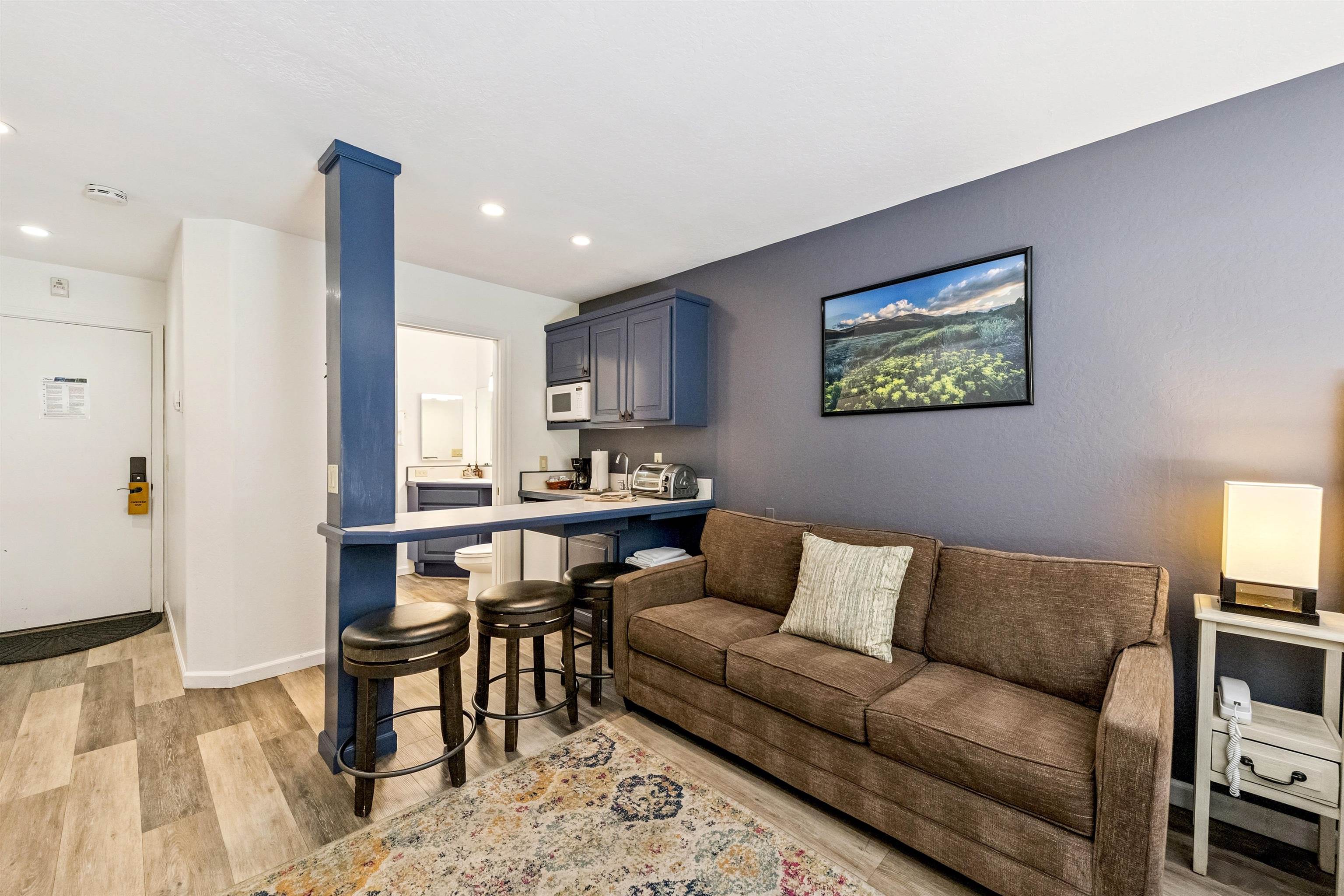 2000 North Village Drive, Unit 234 Truckee, CA 96161 - Photo 8 of 27 a living room with furniture and a dining table with wooden floor