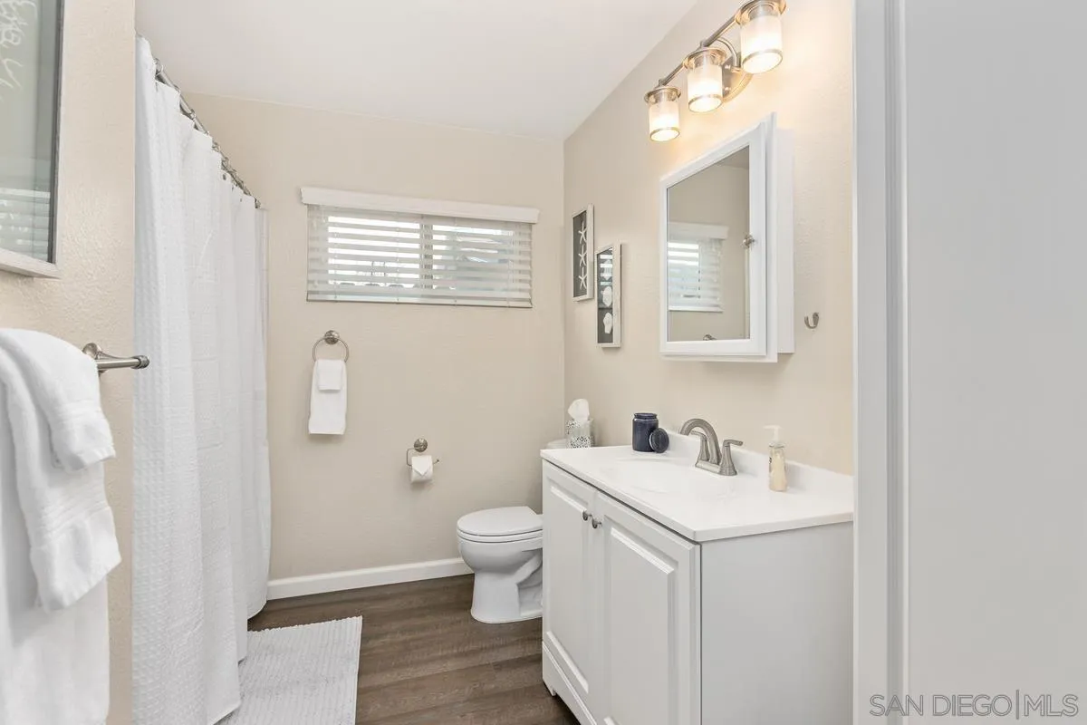 644 Silver Strand Boulevard Imperial Beach, CA 91932 - Photo 14 of 19 a bathroom with a sink toilet and shower