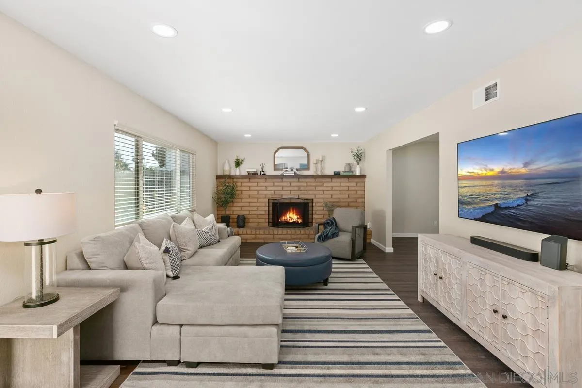 644 Silver Strand Boulevard Imperial Beach, CA 91932 - Photo 3 of 19 a living room with furniture and a fireplace
