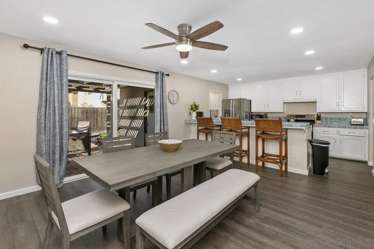644 Silver Strand Boulevard Imperial Beach, CA 91932 - Photo 6 of 19 a living room with stainless steel appliances kitchen island granite countertop furniture wooden floor and a kitchen view