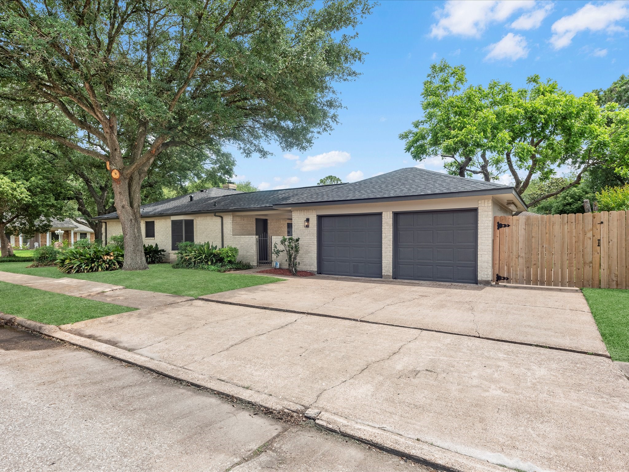 4002 Cujanes Street Pasadena, TX 77504 - Photo 4 of 26 front view of a house and a yard