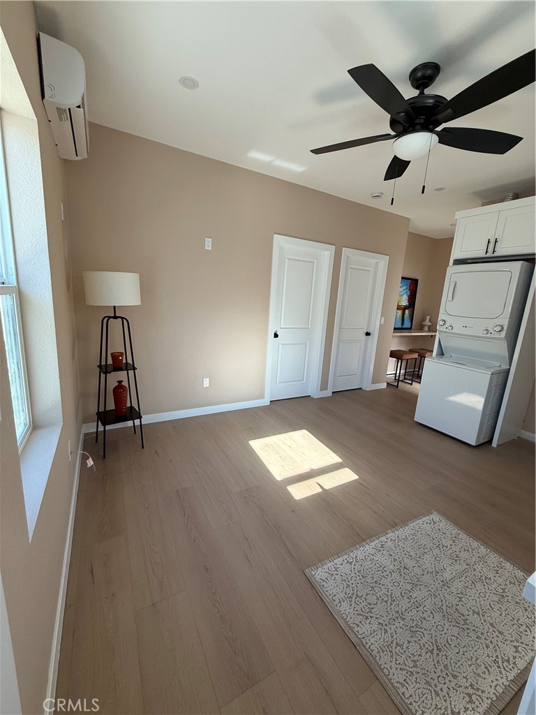 751 East G Street, Unit B Ontario, CA 91764 - Photo 2 of 16 a view of empty room with wooden floor and ceiling fan