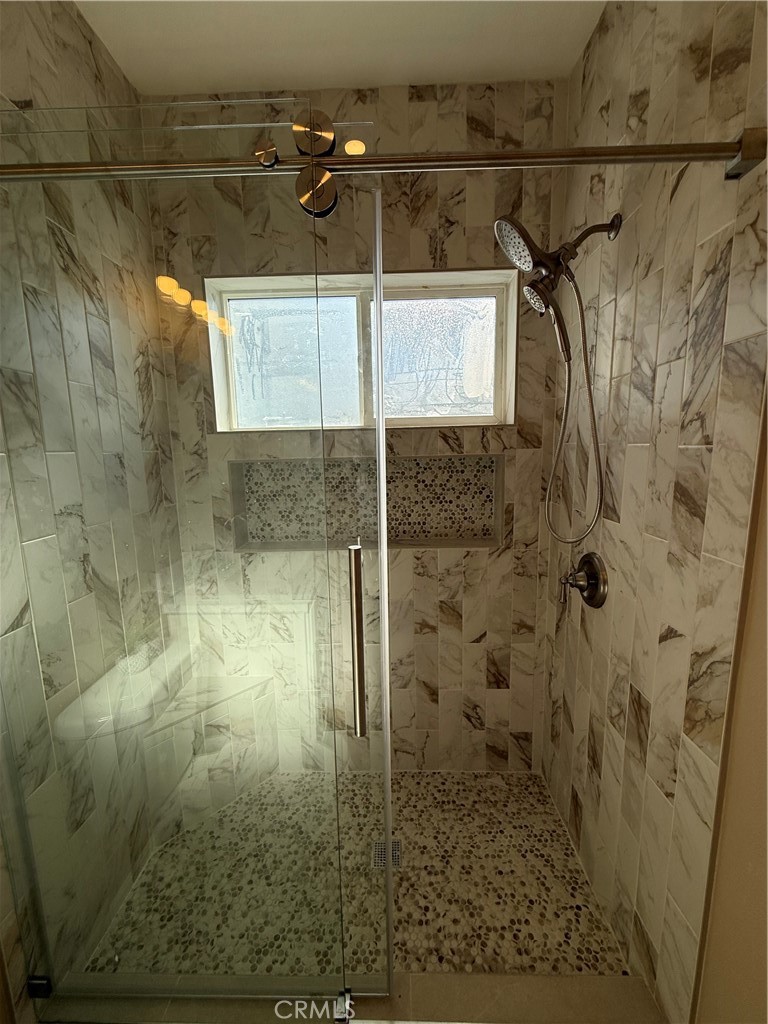 751 East G Street, Unit B Ontario, CA 91764 - Photo 6 of 16 a bathroom with a shower