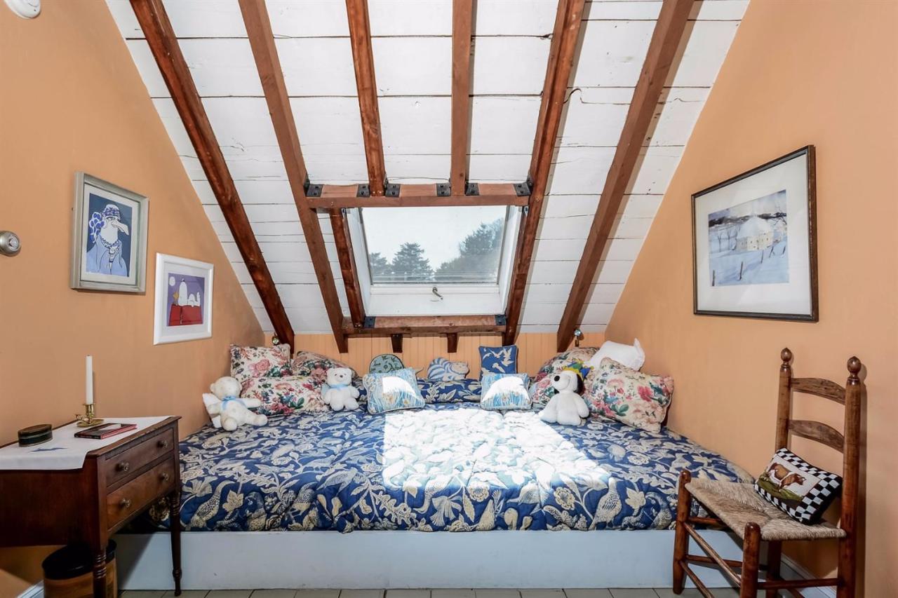 38 Bridge Street Chatham, MA 02633 - Photo 21 of 28 a bedroom with a bed and a window