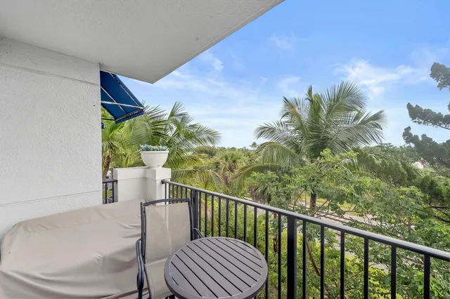 a view of balcony with furniture