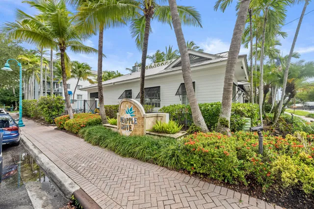 a view of a backyard with swimming pool and sitting area