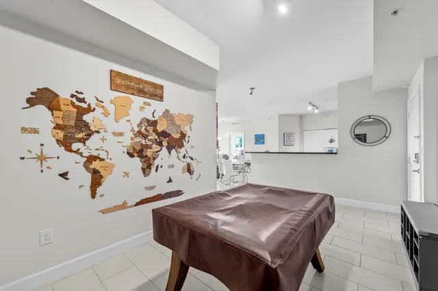 a living room with a table and chairs