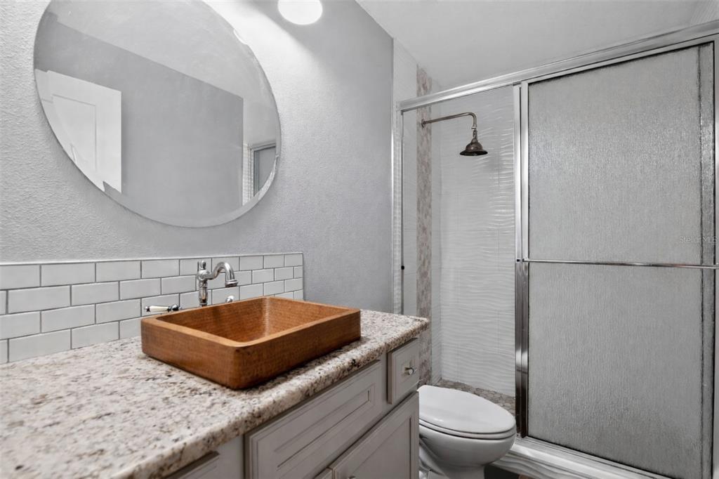 6732 Southwest 109th Lane Ocala, FL 34476 - Photo 15 of 20 a bathroom with a sink a toilet and a mirror