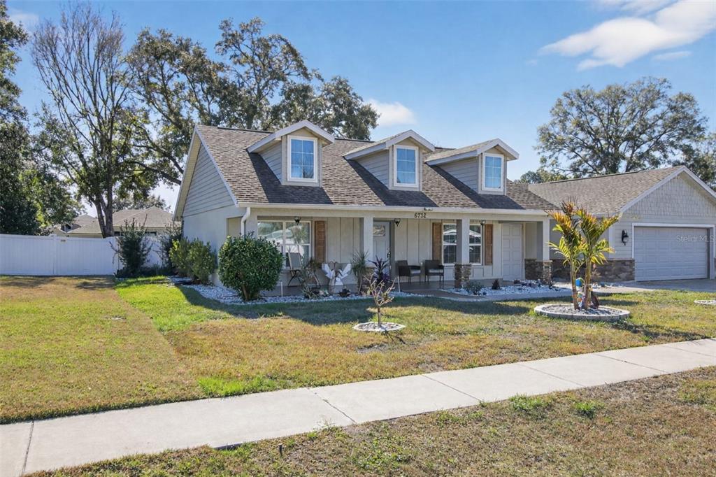 6732 Southwest 109th Lane Ocala, FL 34476 - Photo 2 of 20 a view of a house with swimming pool and sitting area