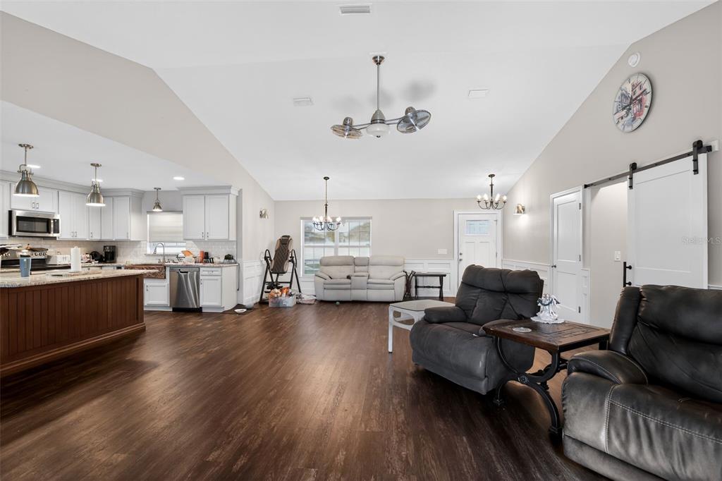 6732 Southwest 109th Lane Ocala, FL 34476 - Photo 5 of 20 a living room with furniture and kitchen view