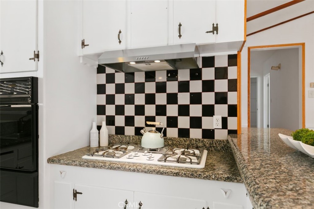3208 West 152nd Place Gardena, CA 90249 - Photo 17 of 35 a kitchen with a sink a stove and a shower