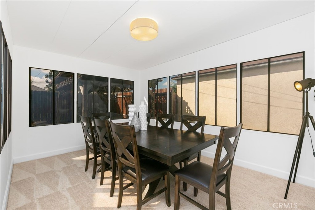 3208 West 152nd Place Gardena, CA 90249 - Photo 19 of 35 a view of a dining room with furniture and window