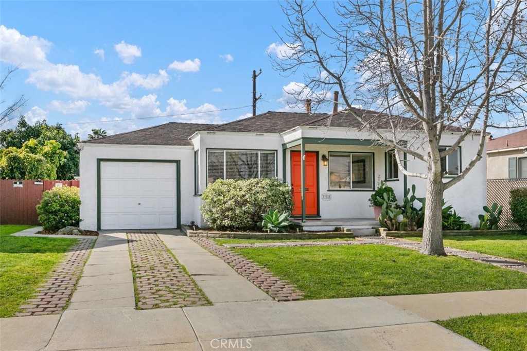 3208 West 152nd Place Gardena, CA 90249 - Photo 2 of 35 a front view of a house with a yard