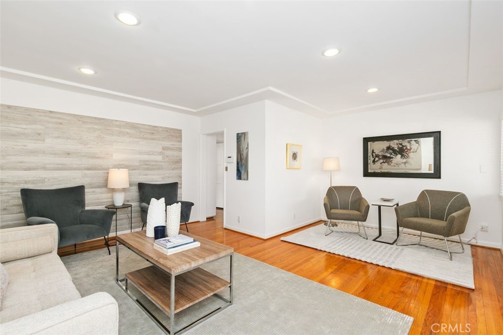 3208 West 152nd Place Gardena, CA 90249 - Photo 3 of 35 a living room with furniture a rug and a fireplace