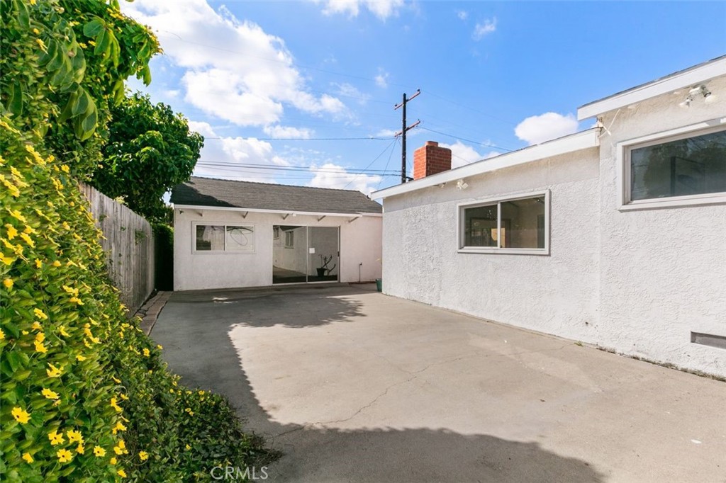 3208 West 152nd Place Gardena, CA 90249 - Photo 33 of 35 a view of a house with a backyard and garage