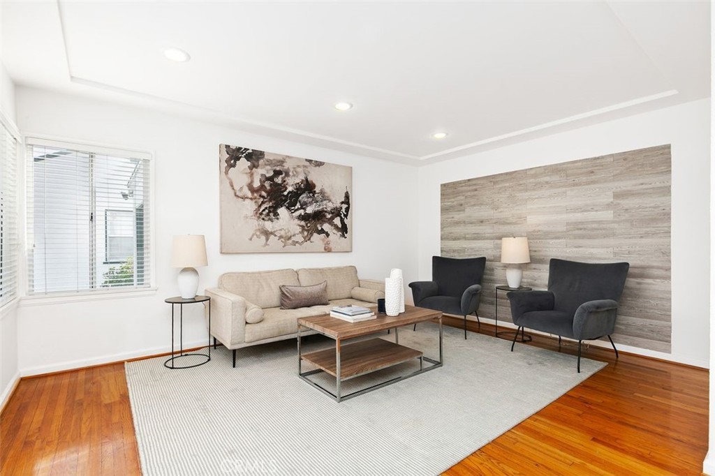 3208 West 152nd Place Gardena, CA 90249 - Photo 4 of 35 a living room with furniture and a fireplace
