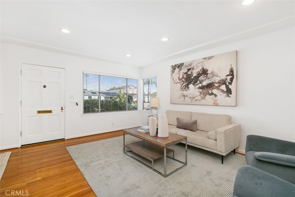 3208 West 152nd Place Gardena, CA 90249 - Photo 6 of 35 a living room with furniture and a rug