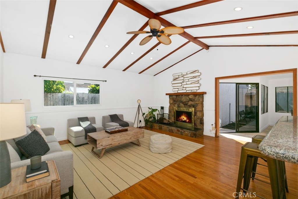 3208 West 152nd Place Gardena, CA 90249 - Photo 9 of 35 a living room with furniture and a fireplace
