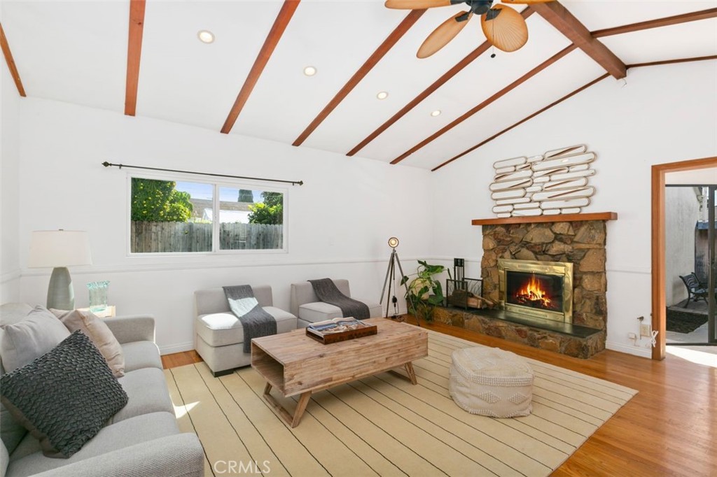 3208 West 152nd Place Gardena, CA 90249 - Photo 10 of 35 a living room with furniture and a fireplace